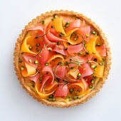 Melon crostata with lime cream and pistachios