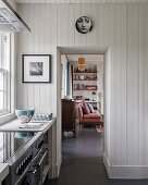 Wall plate above doorway in renovated tongue and groove kitchen