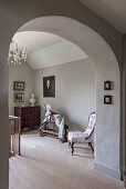 Antique rocking horse and chest with chair on landing in restored 16th century farmhouse