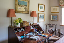 Writing desk and pair of lamps with antique carved wooden chair