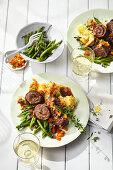 Braised beef roulade with pumpkin chutney and beans