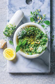 Ingredients for pesto in mortard