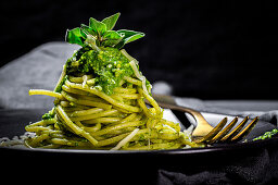 Pasta with pesto sauce and Parmesan cheese
