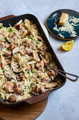 Oven baked risotto with sausage, mushrooms and peas
