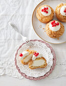Buns with cream hat and currants