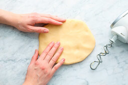 Shortcrust pastry being shaped to help it cool down quicker