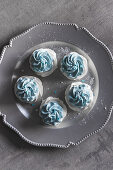 Meringue nests with pastel blue cream