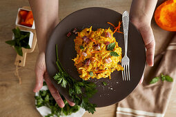 Raw pumpkin noodles with pancetta and cooking cream