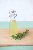 Rosemary hydrosol (extract) in a small flip-top bottle