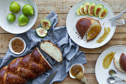 Braided bread served with fresh figs and sweet fruit jam
