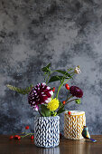 Autumn flowers in vases handmade from braided modelling clay