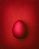 Dark red Easter egg on a dark red background