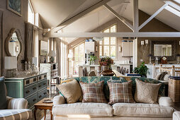 Classic, beige living room with exposed roof structure