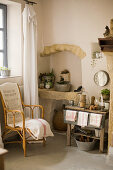 Rattan chair and old table on a wall niche with junk