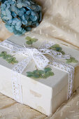 Gift box with dried hydrangeas and lace ribbon