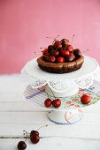 Mini chocolate cake with fresh cherries