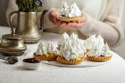Tartlets with cream and meringue icing