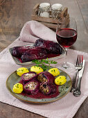 Two stuffed red cabbage roulade with boiled potatoes