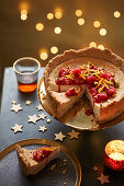 Baked vegan cheesecake with raspberries and clementine