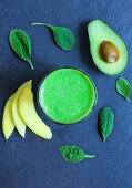 A green smoothie made from avocado, spinach and mango