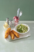 Breaded chicken fingers with fennel salad