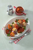 Turkey-pumpkin skewers with mango-tomato sauce