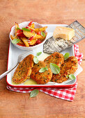Schnitzel in parmesan crust and oven vegetables