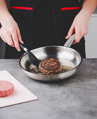 Frying burgers in a frying pan