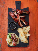 Peking-style ribs with pancakes and plum sauce