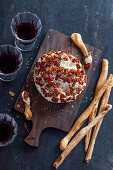 Cheese ball with dried tomatoes, eggplants and caviar