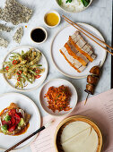 Chinese menu with pork belly, PEking duck, lotus flowers and tempura