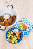 Herbal croquettes with dip and salad