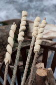 Bread dough for stick bread wound around twigs