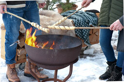 Toasting stick bread over an open fire