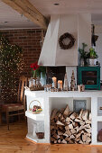 Christmas decorated rural kitchen with wood storage