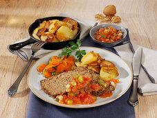 Vegetarian nut roast with carrots and fried potatoes