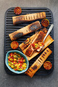 Cajun salmon grilled in woodsheets with a mango and lime salsa