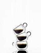 Three glass cups with black coffee