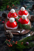 Santa hats with raspberry icing and coconut balls