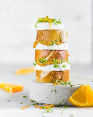 Pretzel slices with goat’s cheese, orange mustard and cress