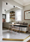 Filigree table with chairs and bench in contemporary kitchen