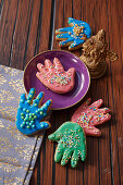 Cookies in the shape of the Indian protection symbol 'Hamsa's hand'