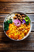 Carrot curry bowl with paneer and cashew nuts