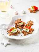 Star-shaped canapes with salmon