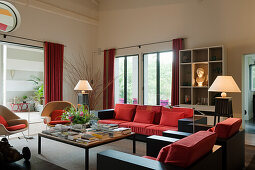 A living room in converted warehouse with a range of seating furniture