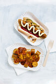 A vegan hot dog and vegan curried sausage