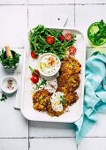 Potato and zucchini hash browns with quark cream and rocket salad