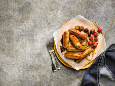 Pan-Fried pork and leek sausages with roasted cherry tomatoes and mushrooms