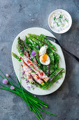 Asparagus fried in bacon with a soft-boiled egg