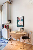 Fold-out dining table and chair in open plan kitchen